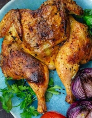 grilled whole chicken on platter