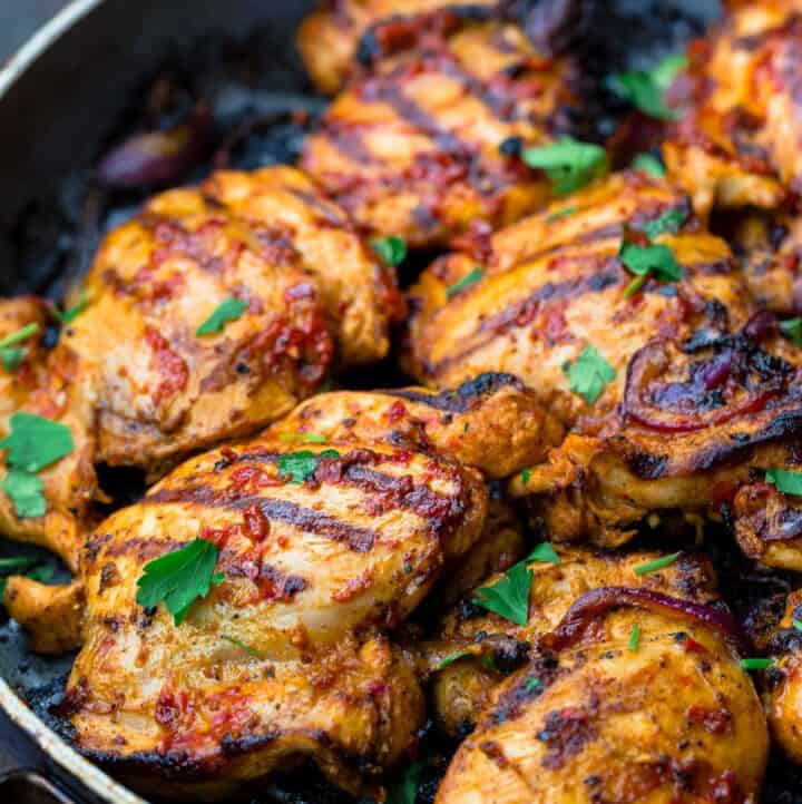 grilled harissa chicken in a pan