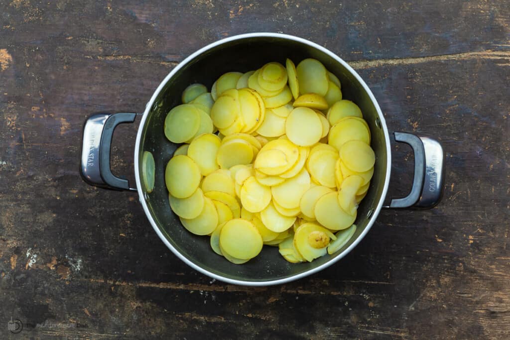 Sliced cooked poatoes in a pot