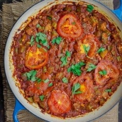 okra and tomatoes in skillet, garnished with parsley