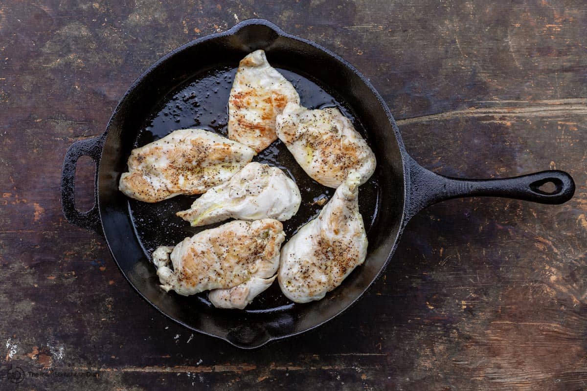 Cooked chicken cutlets in skillet