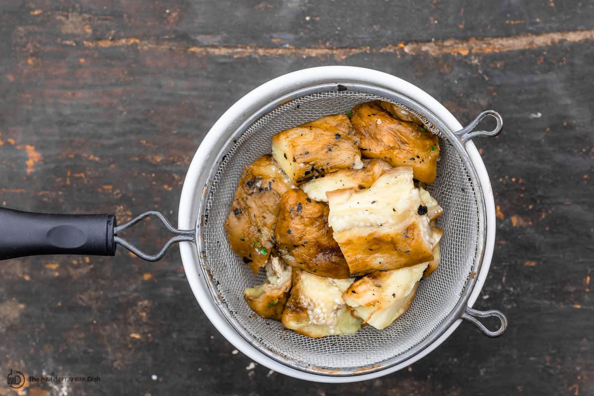 Eggplant chunks in a colander 