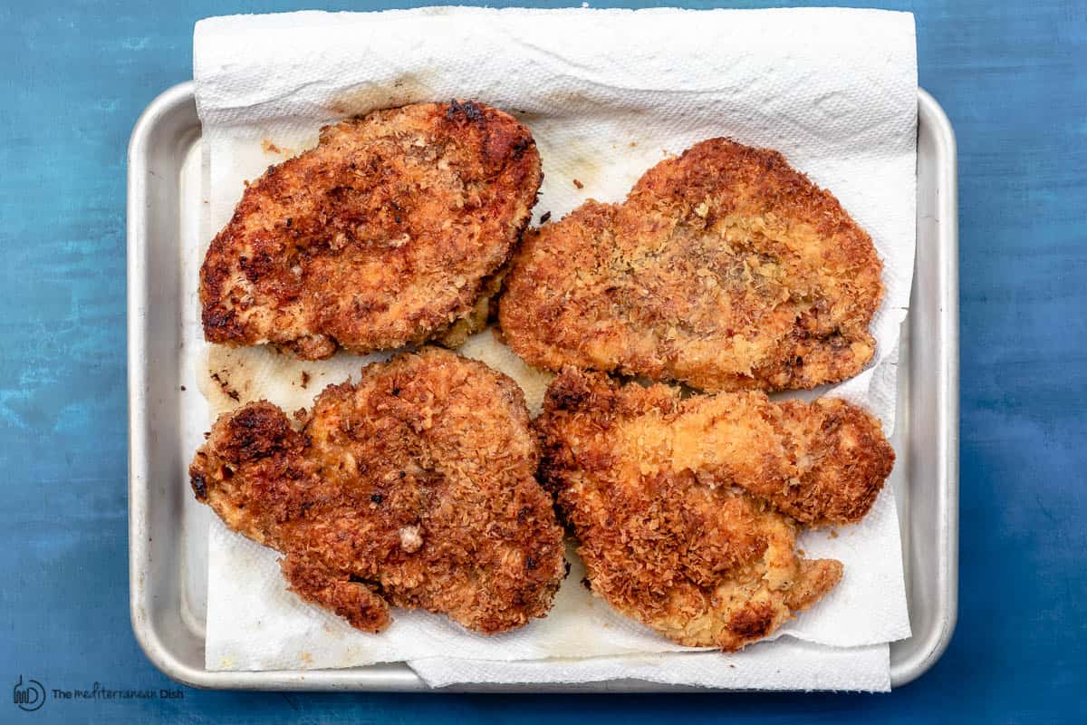 fried chicken breasts on a paper towel