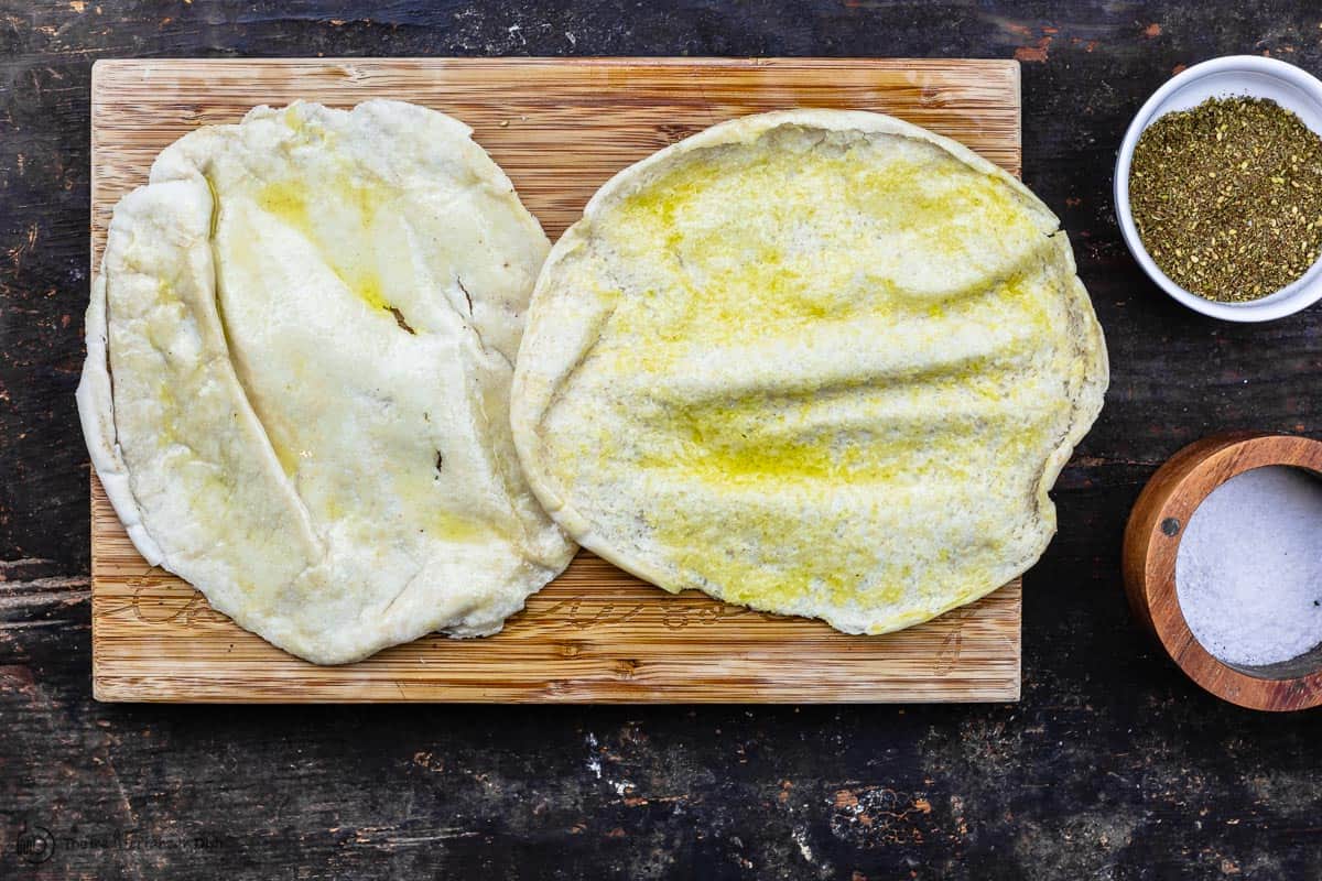 one pita pocket split into two rounds and brushed with olive oil