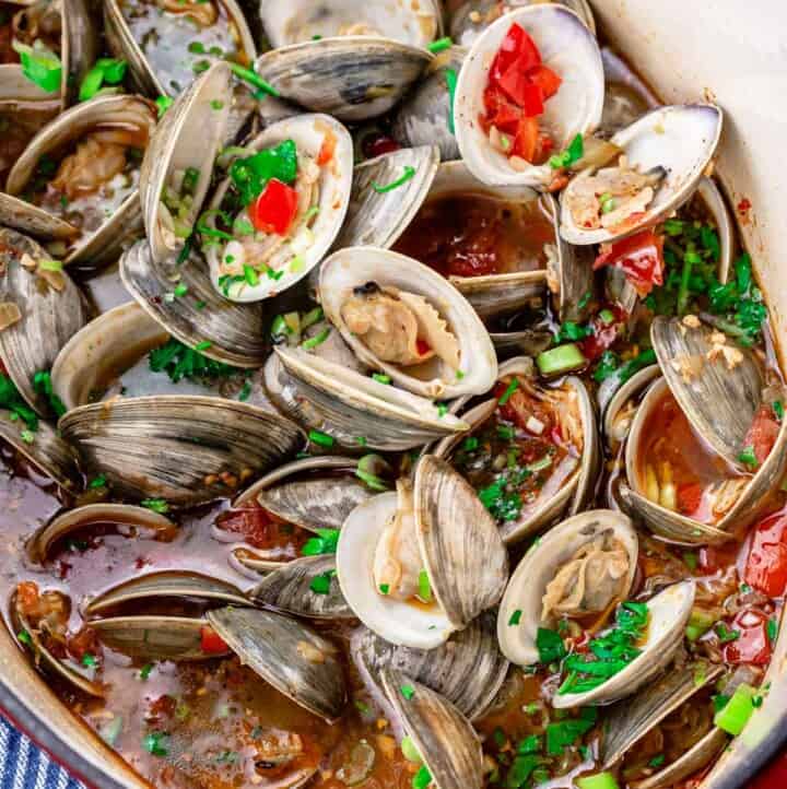 Mediterranean steamed clams in a large pot