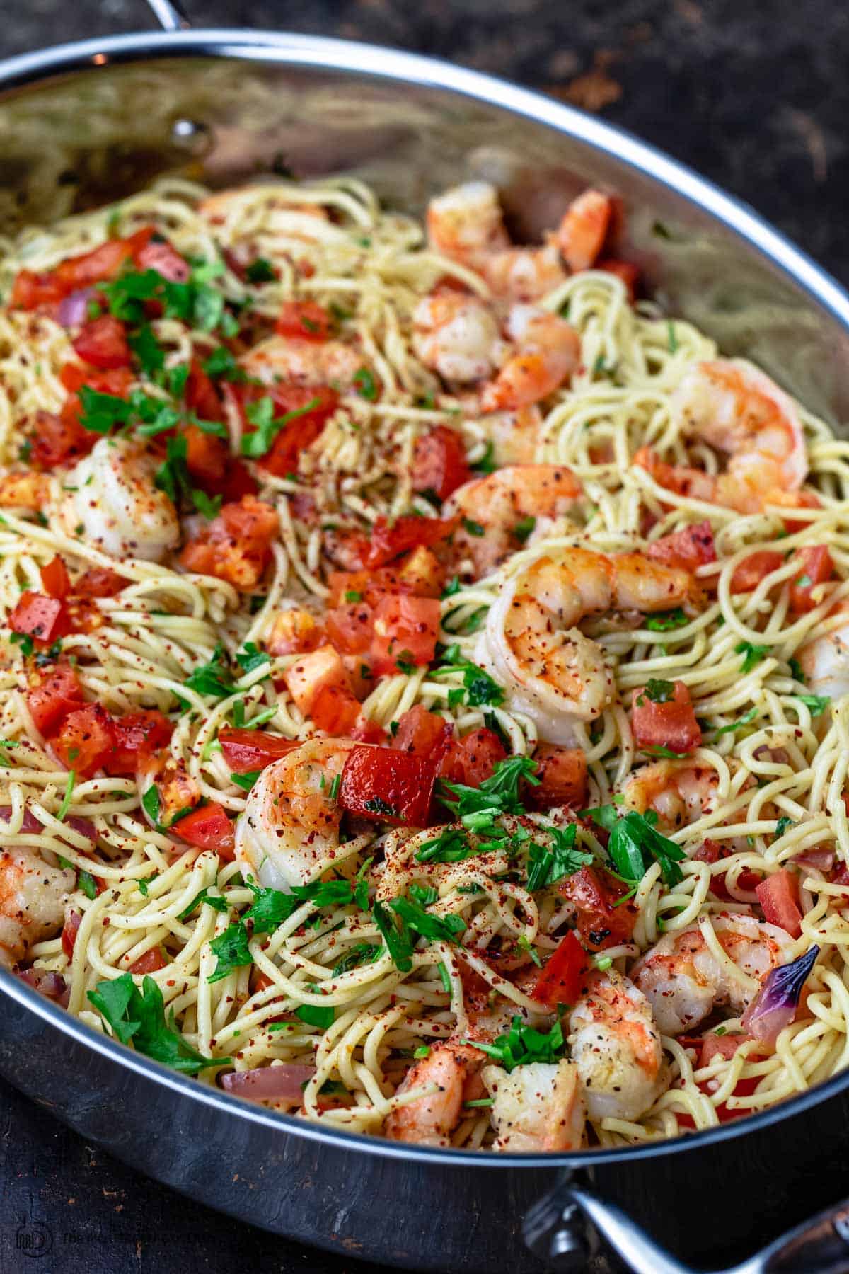 Shrimp pasta garnished with parsley and parmesan