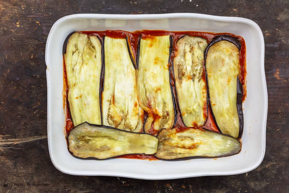 roasted eggplant spread on bottom of baking dish