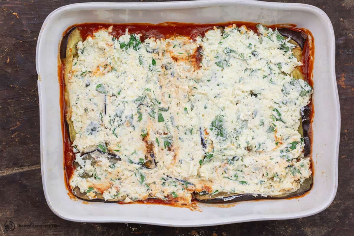 layer of ricotta cheese on top of eggplant slices