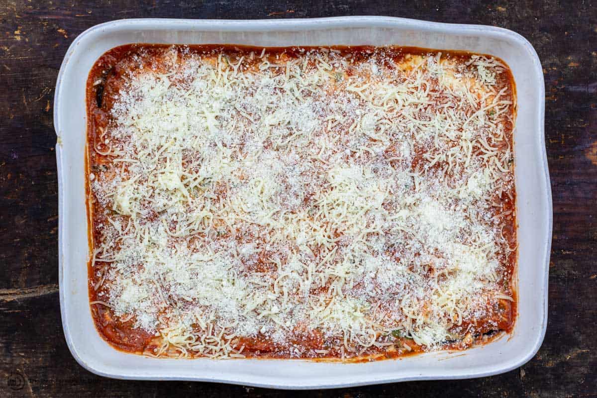 eggplant lasagna assembled in baking dish before cooking