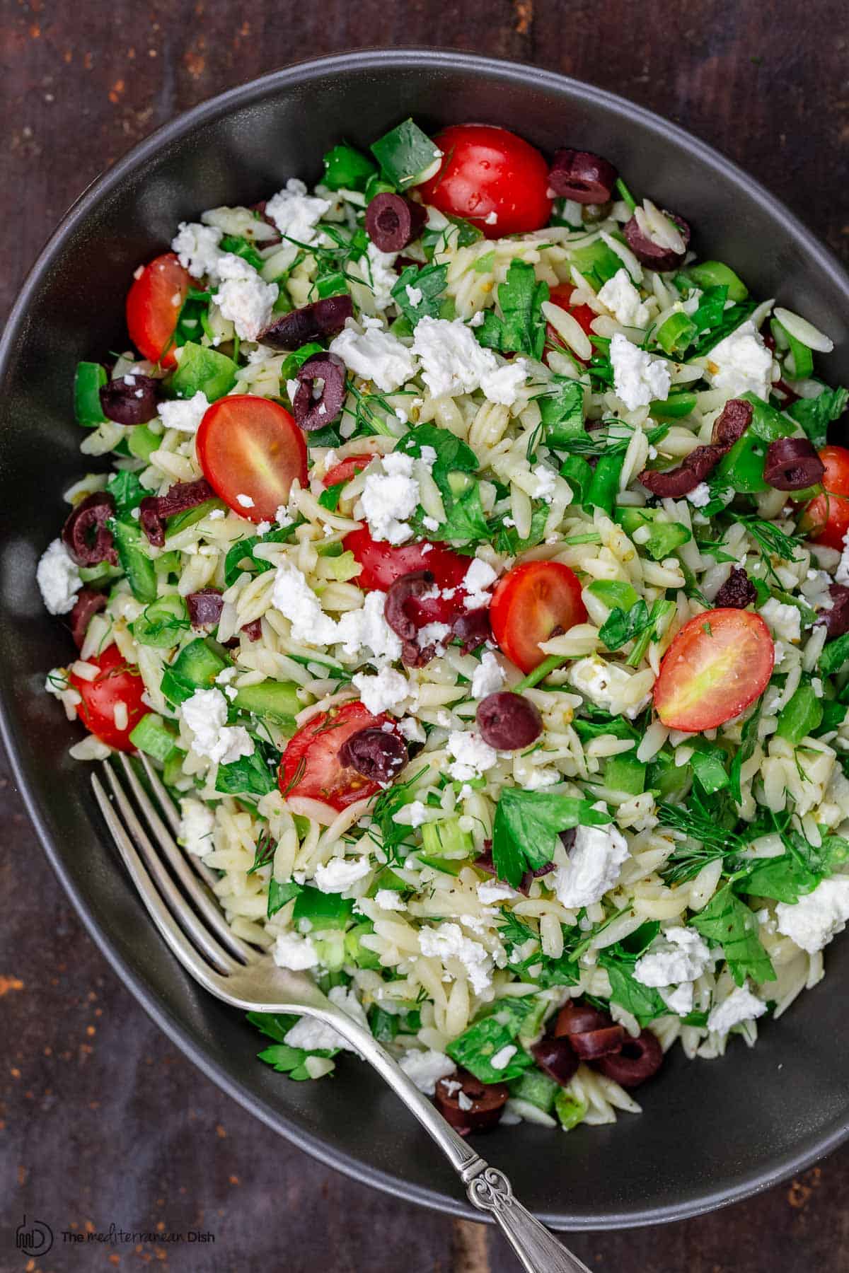 Mediterranean orzo salad in a large bowl