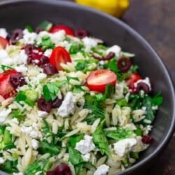 Greek orzo salad with a side of lemons