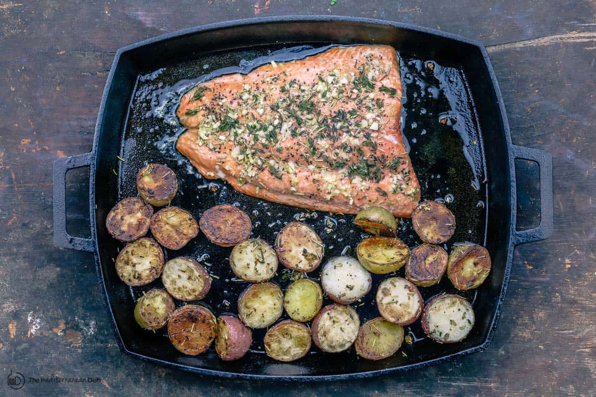 Salmon added next to potatoes for roasting