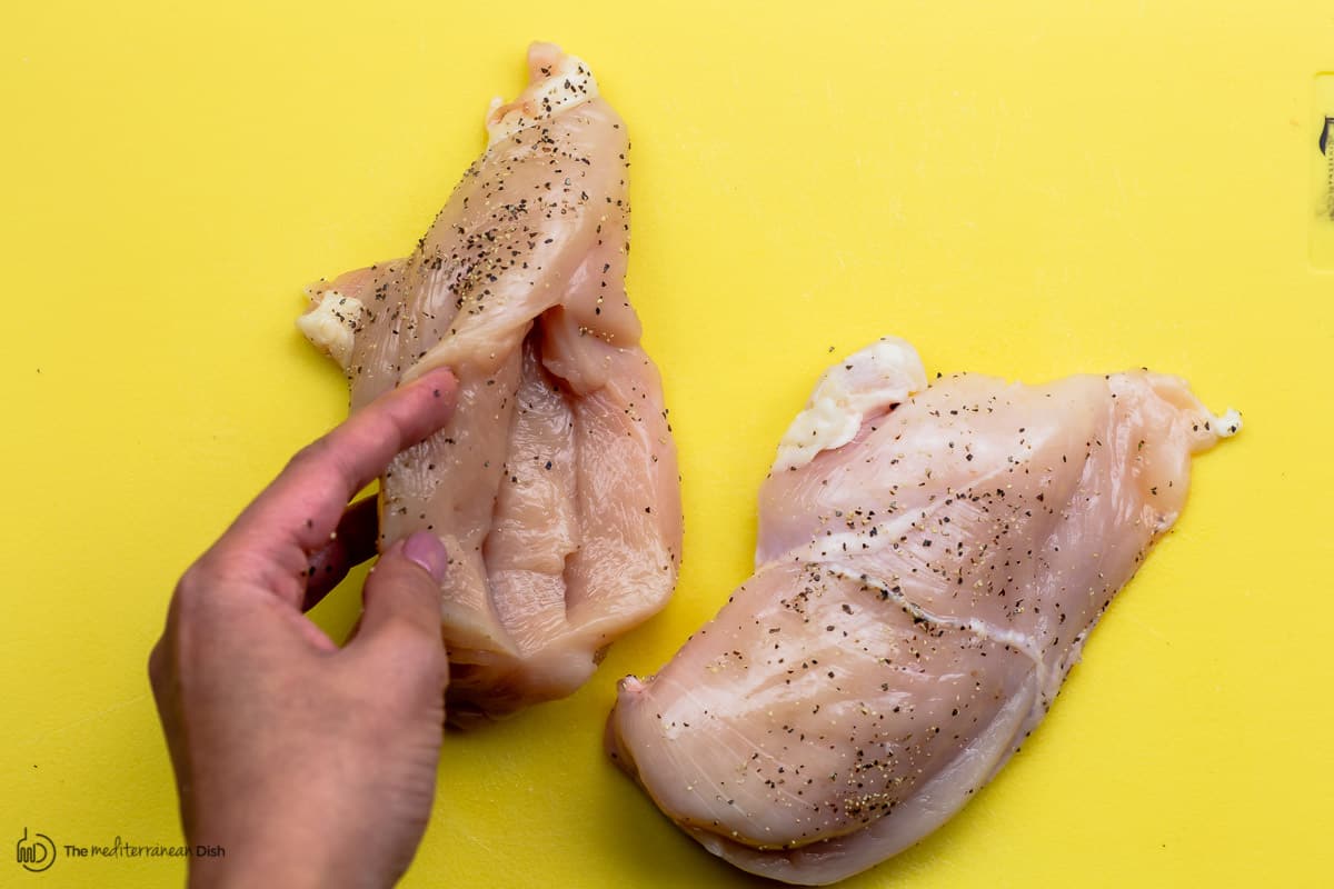 Chicken breast cut partway through