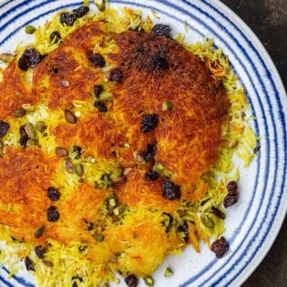 Persian rice tahdig, garnished with dried cherries and pistachios
