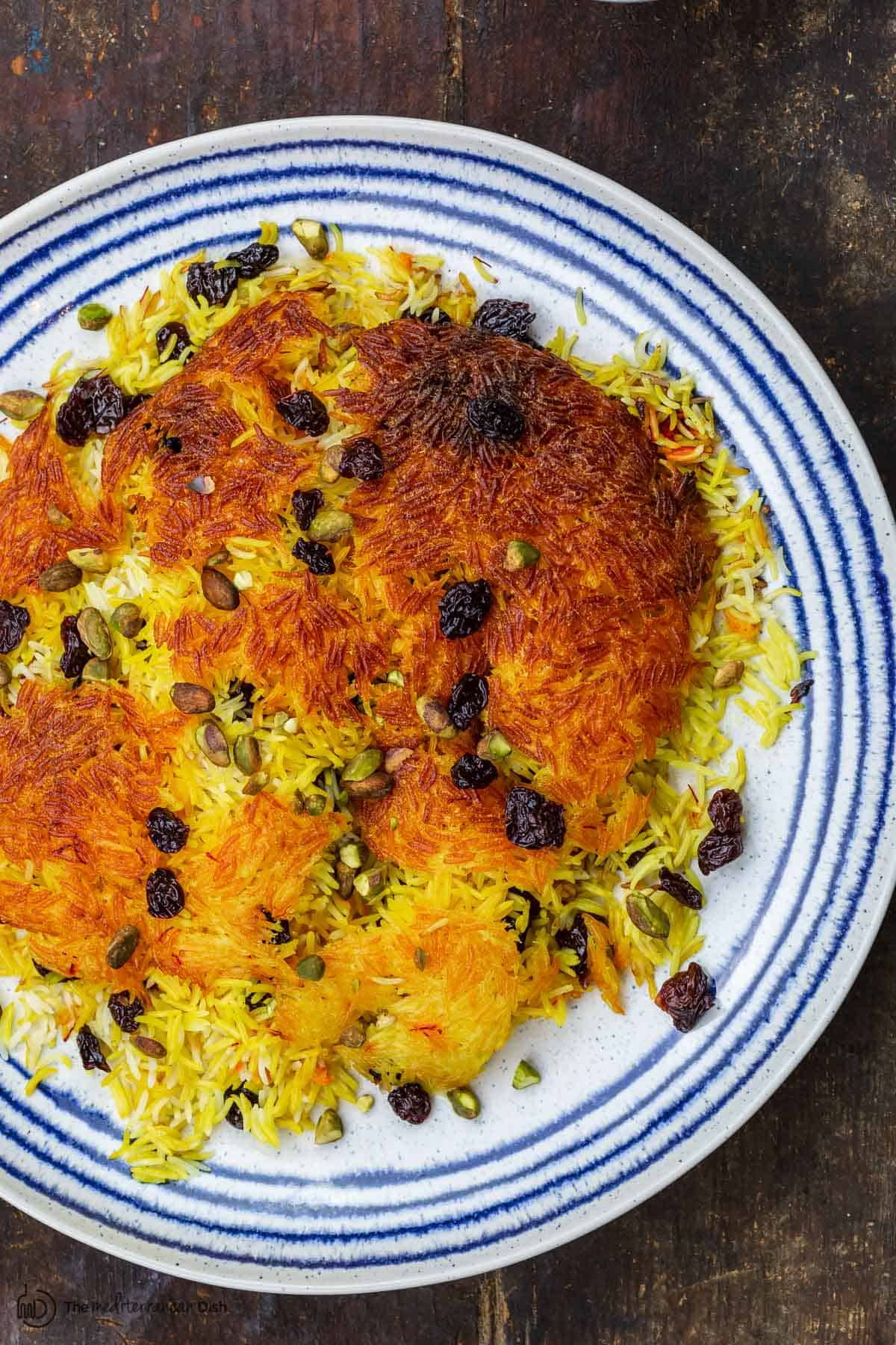 Persian rice tahdig, garnished with dried cherries and pistachios