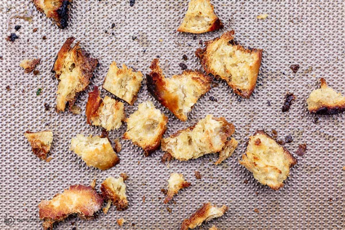 chunks of toasted bread on a sheet pan