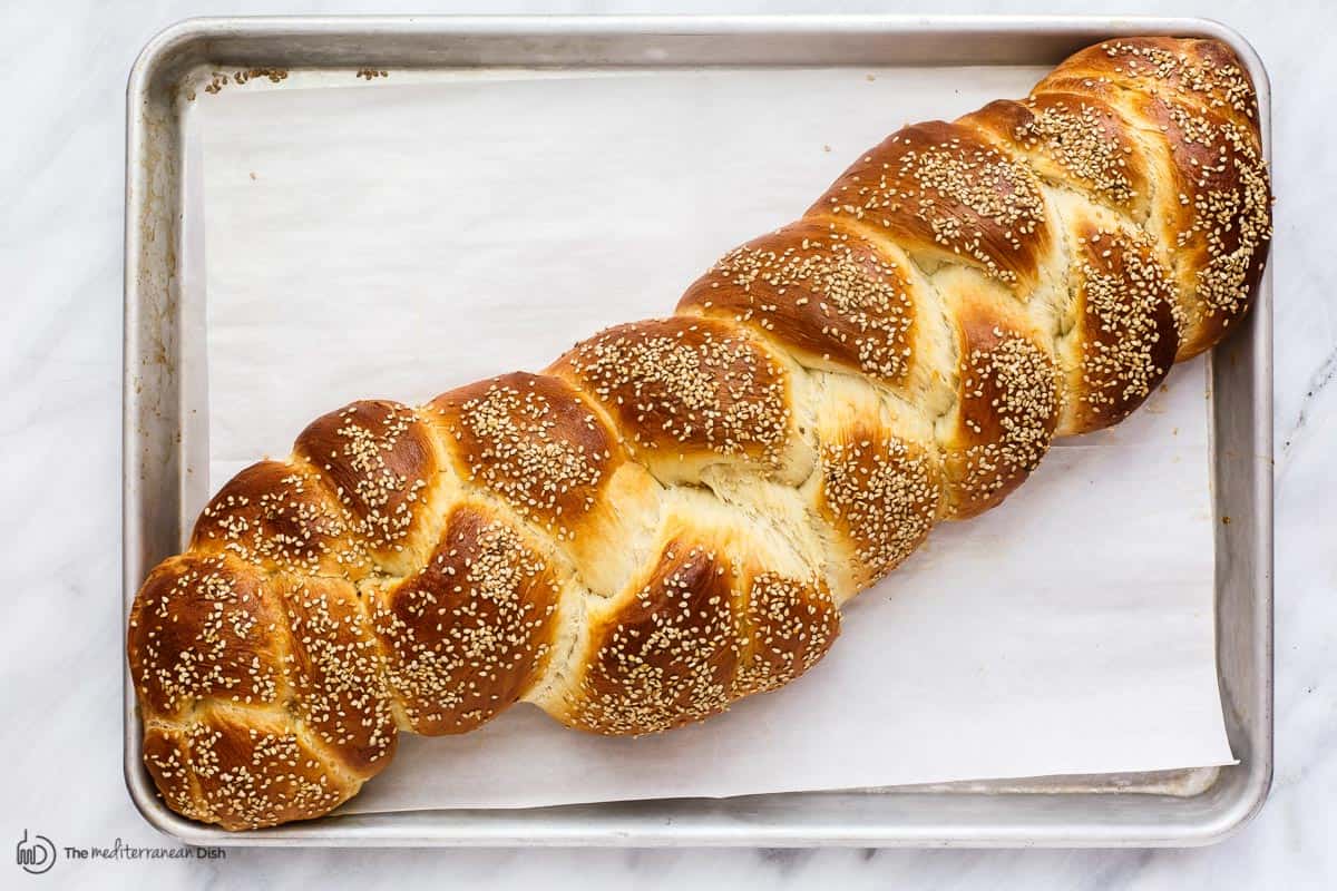 Baked challah bread in baking sheet