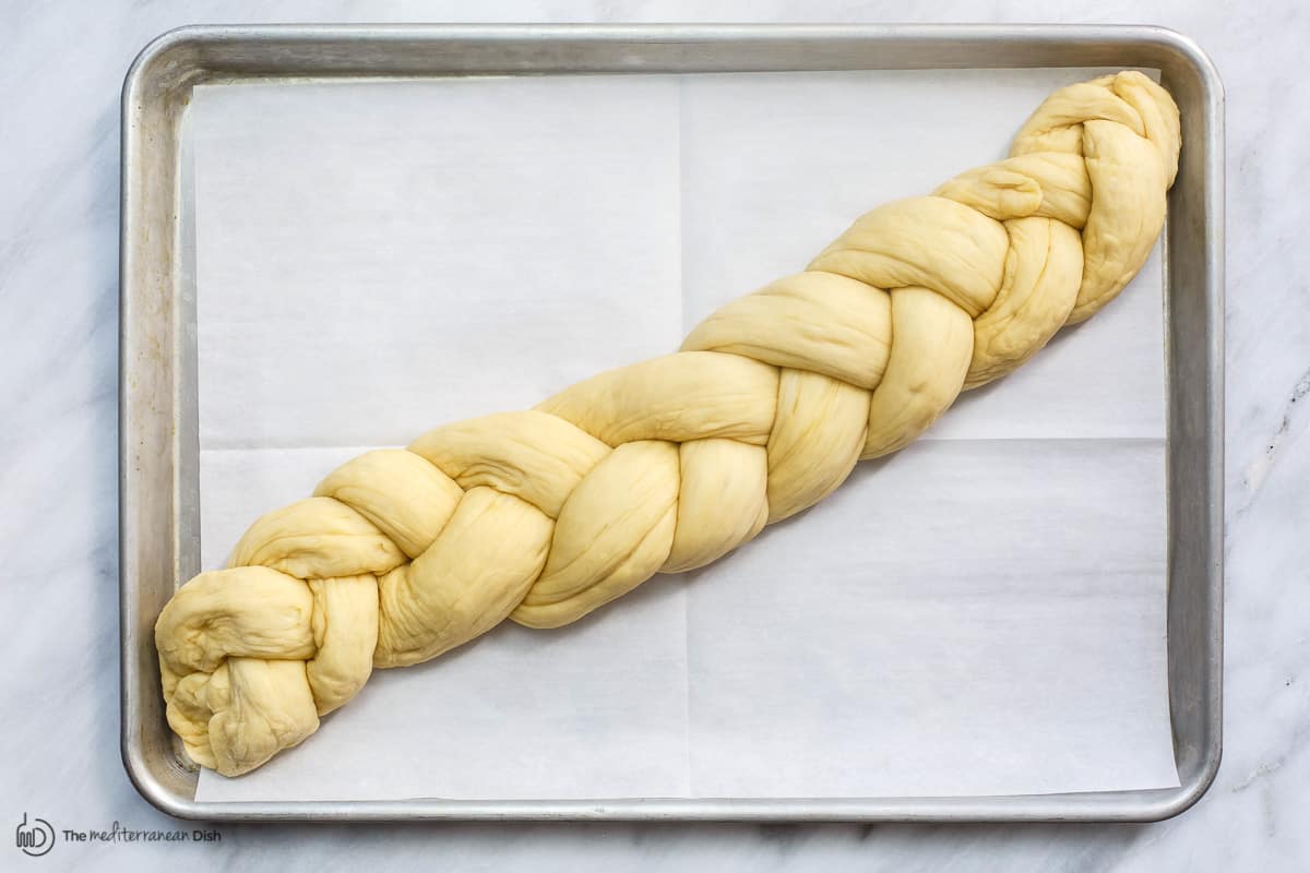Braided dough on baking sheet