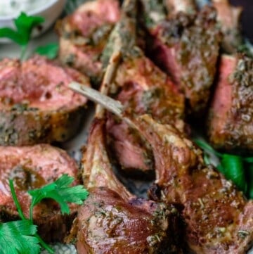 Roast Rack of Lamb cut into chops with a side of tzatziki sauce
