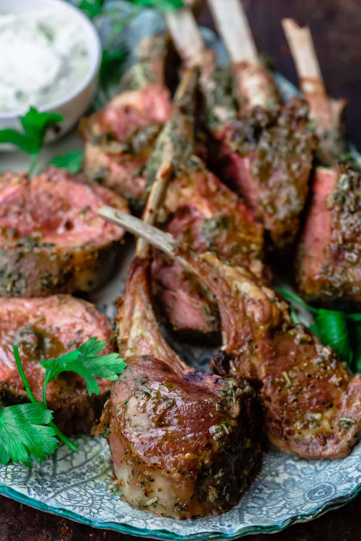 Roast Rack of Lamb cut into chops with a side of tzatziki sauce