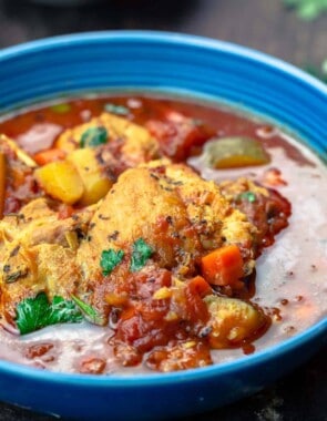 Mediterranean-style chicken stew served in a blue bowl