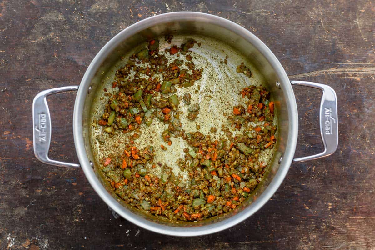 onions, celery, carrots and spices cooked in a pot