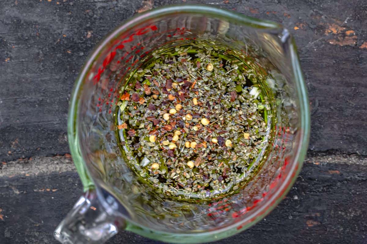 salad dressing in a measuring cup