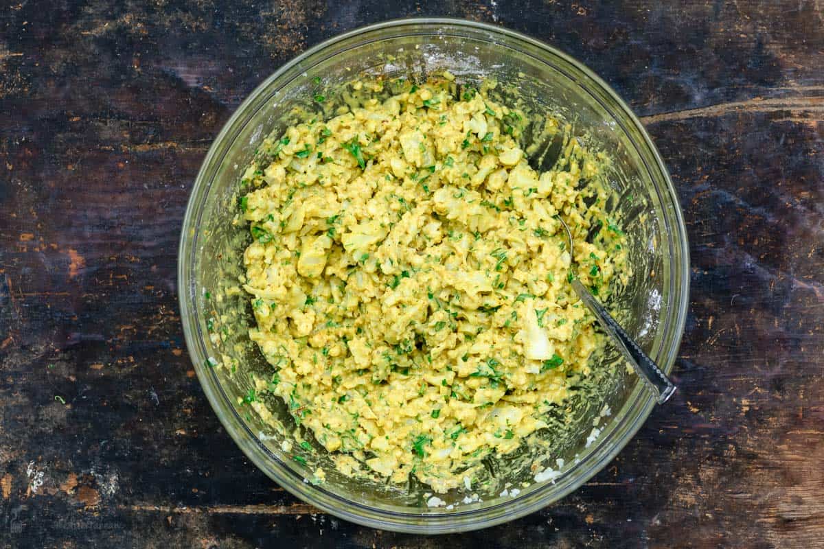 Mix for cauliflower fritters in a bowl