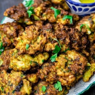 Cauliflower fritters served on a plate
