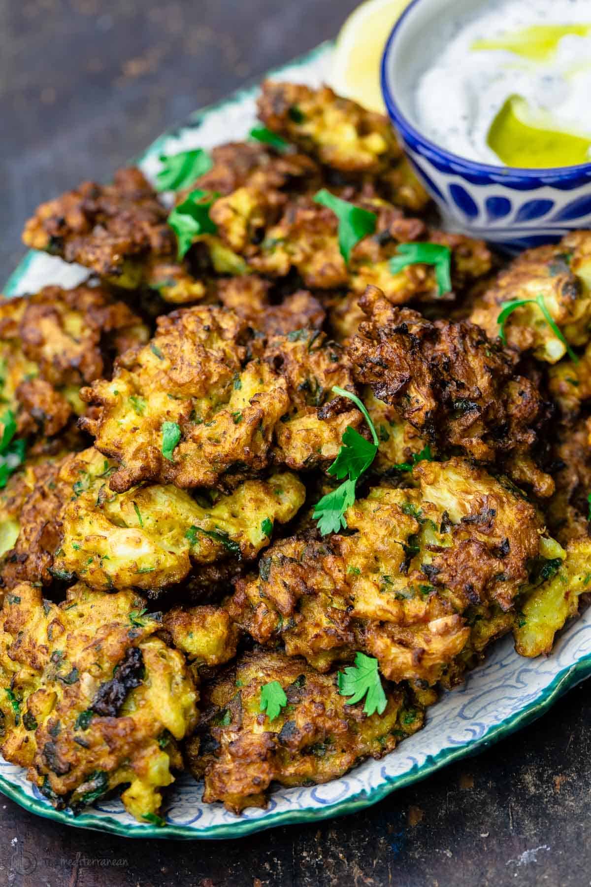 Cauliflower fritters served on a plate