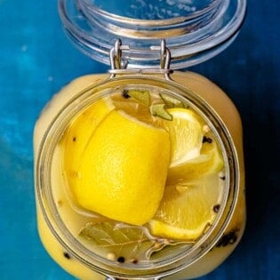 Top down picture of preserved lemons in a jar