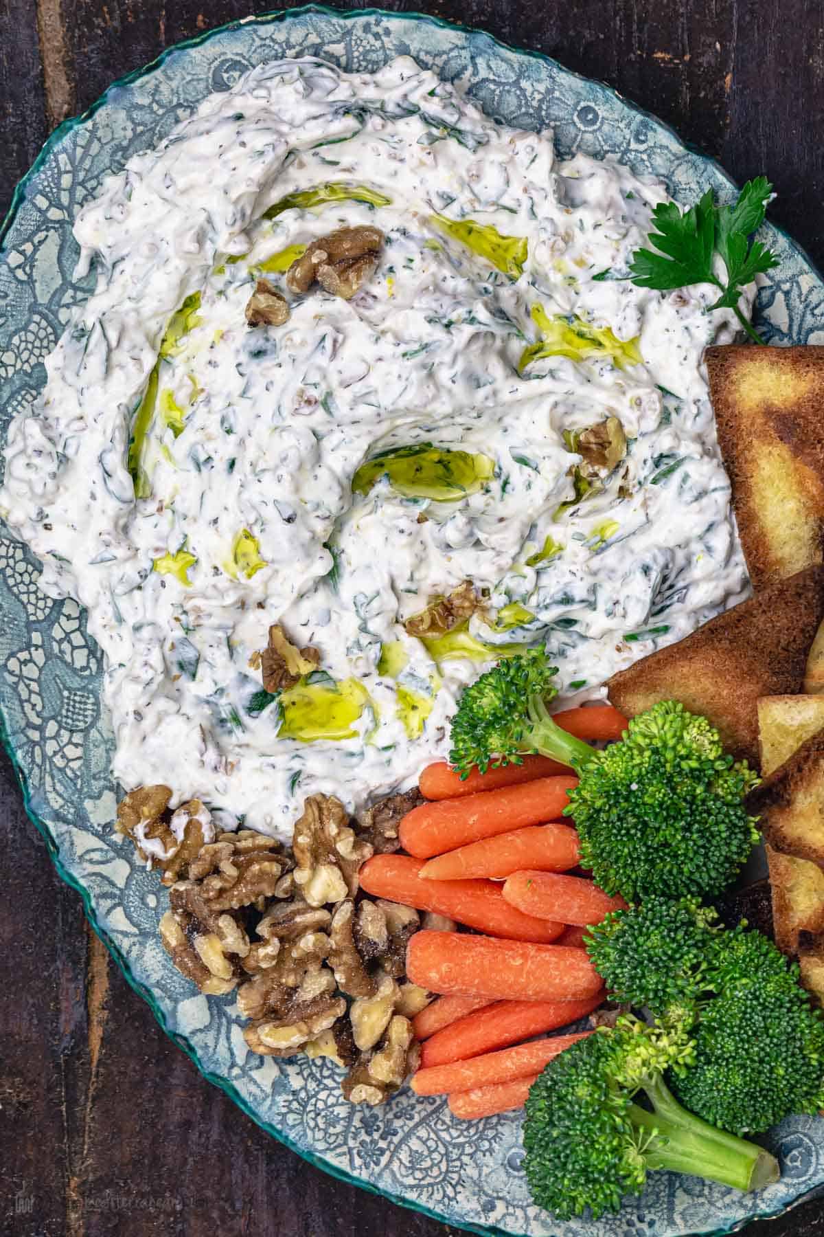 spinach Greek yogurt dip served with vegetables and pita chips