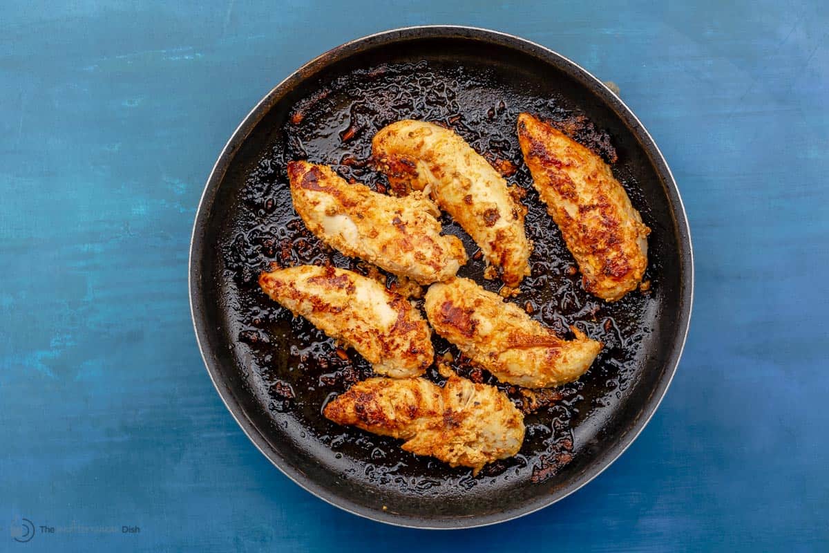 Chicken breasts cooked in a frying pan