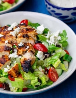 Greek chicken salad served in a white bowl