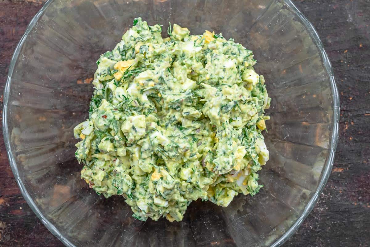 fully mixed avocado egg salad in a bowl