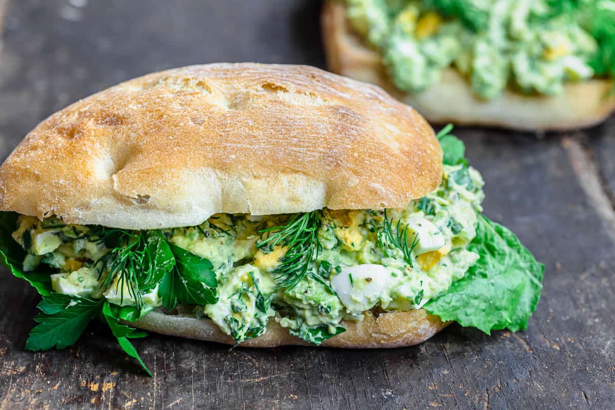 Avocado egg salad sandwich placed on a table