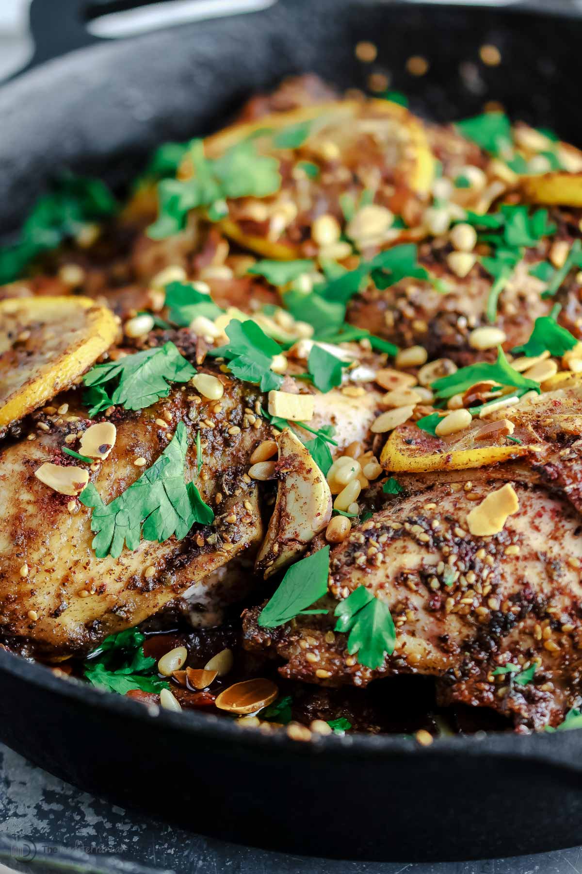 Angle picture of za'atar roasted chicken in a skillet