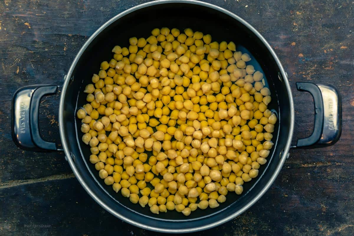 Chickpeas soaked in a pot of water