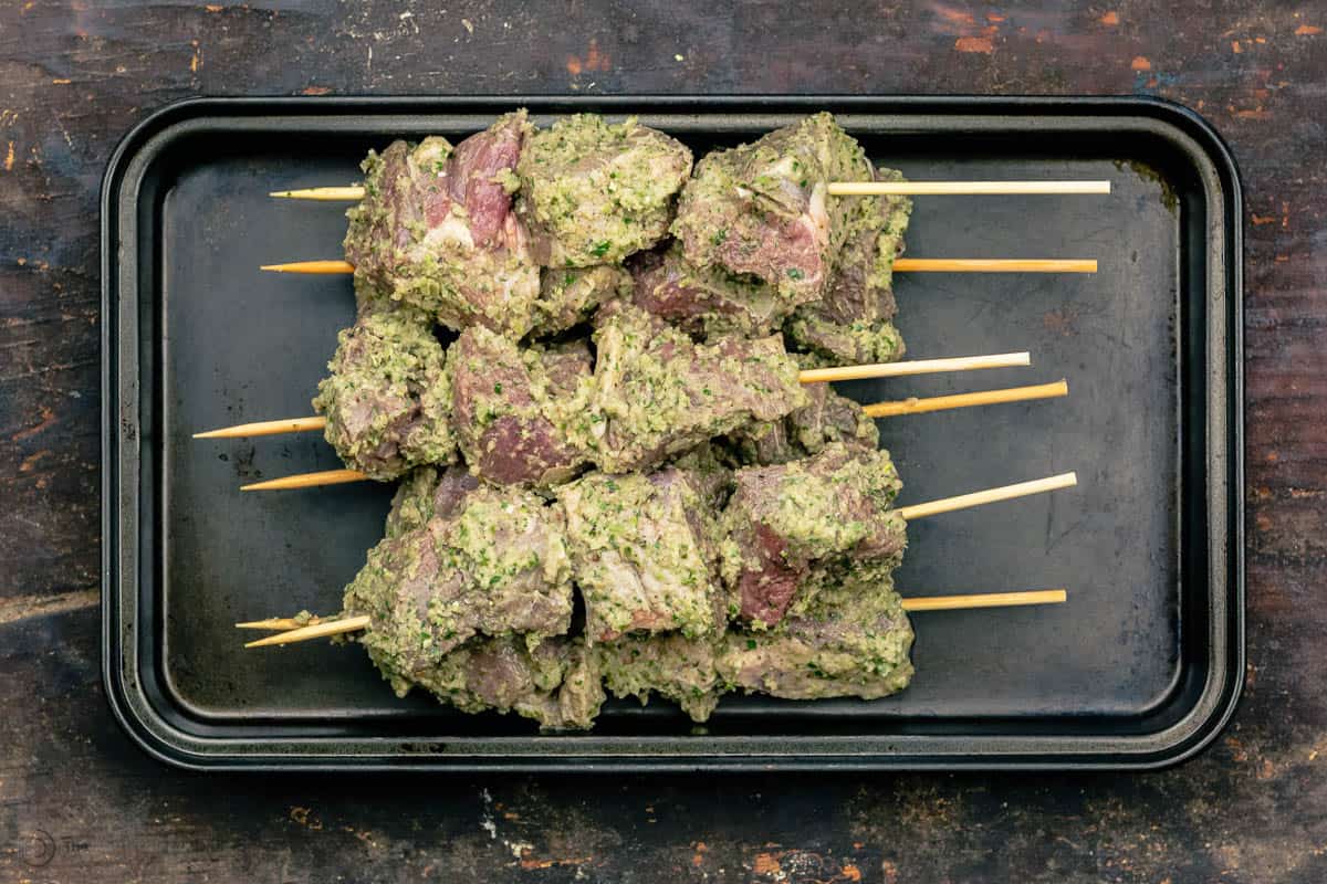 lamb kabobs skewered and placed in a tray