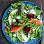 Beet salad served on a blue plate