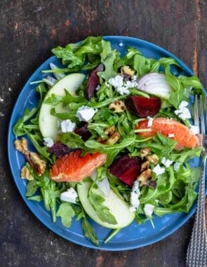 Beet salad served on a blue plate