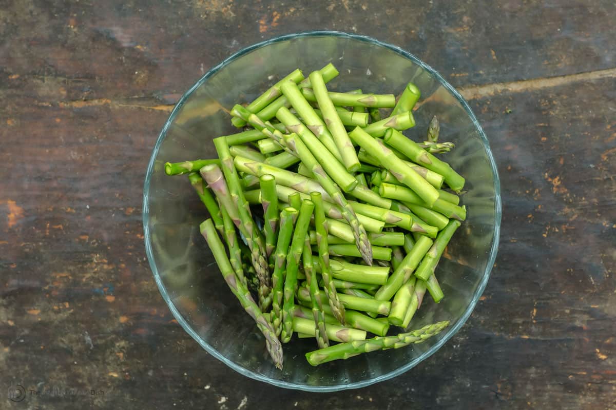 Asparagus pieces in a glass bowl