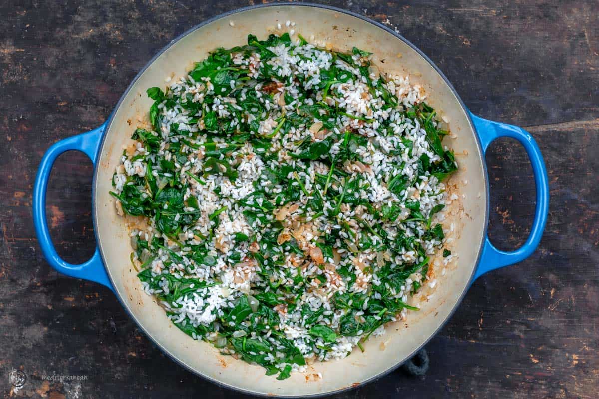 Spinach and rice in a pan