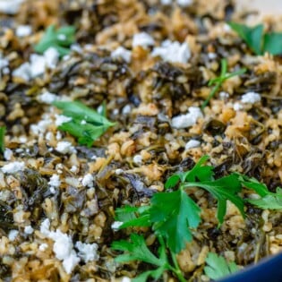 Spanakorizo topped with spinach and feta