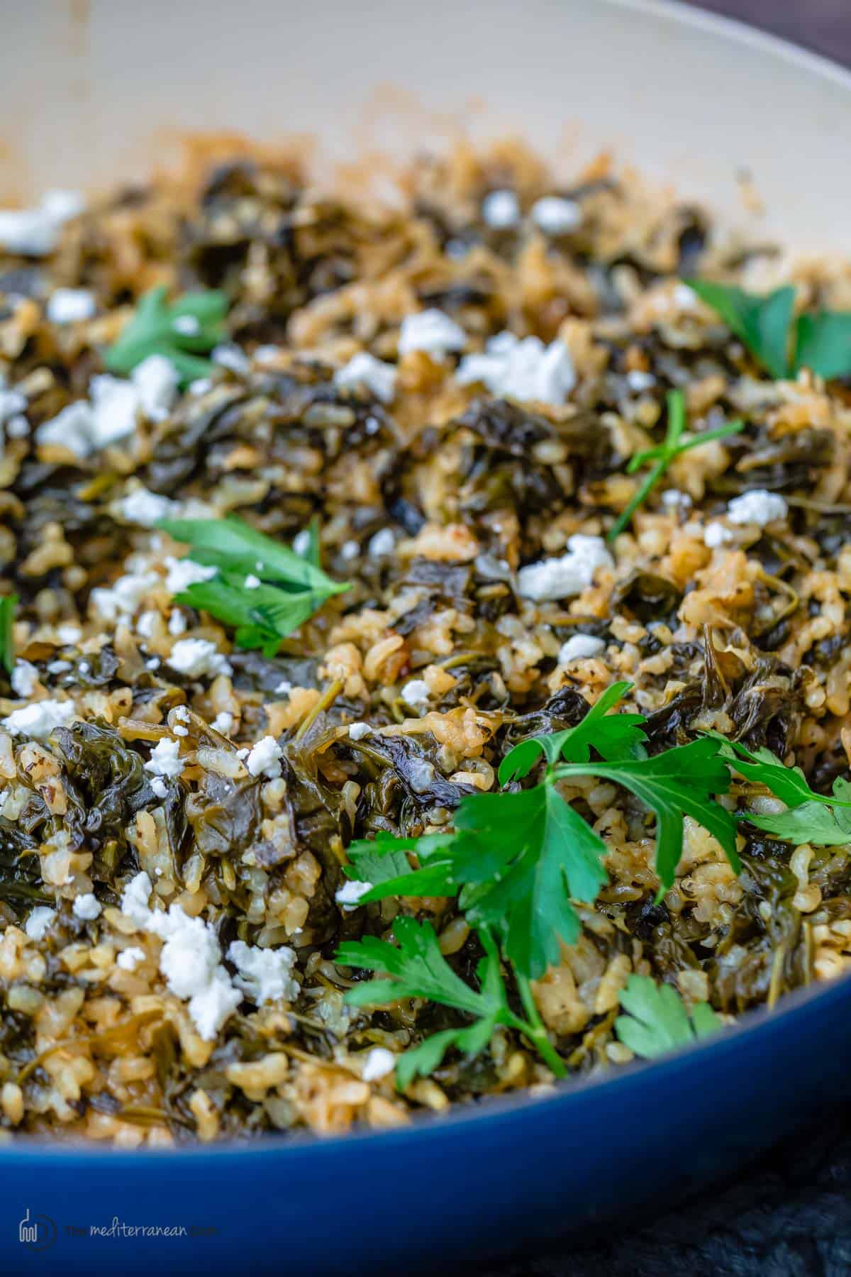 Spanakorizo topped with spinach and feta