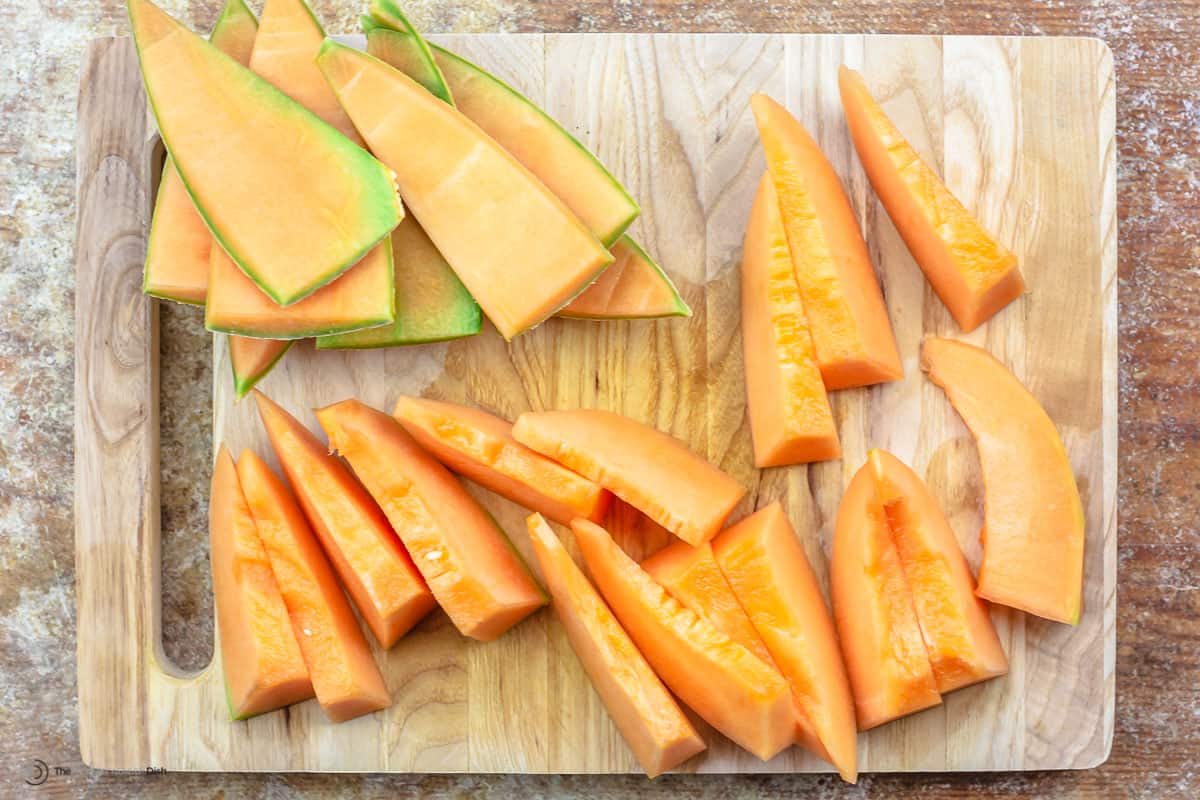 Sliced cantaloupe on a cutting board