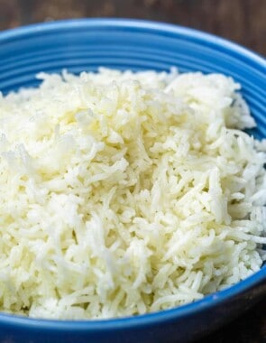 A blue dish with a heap of basmati rice