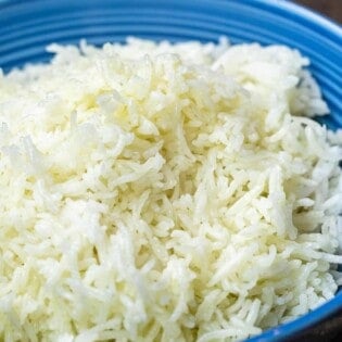 A blue dish with a heap of basmati rice