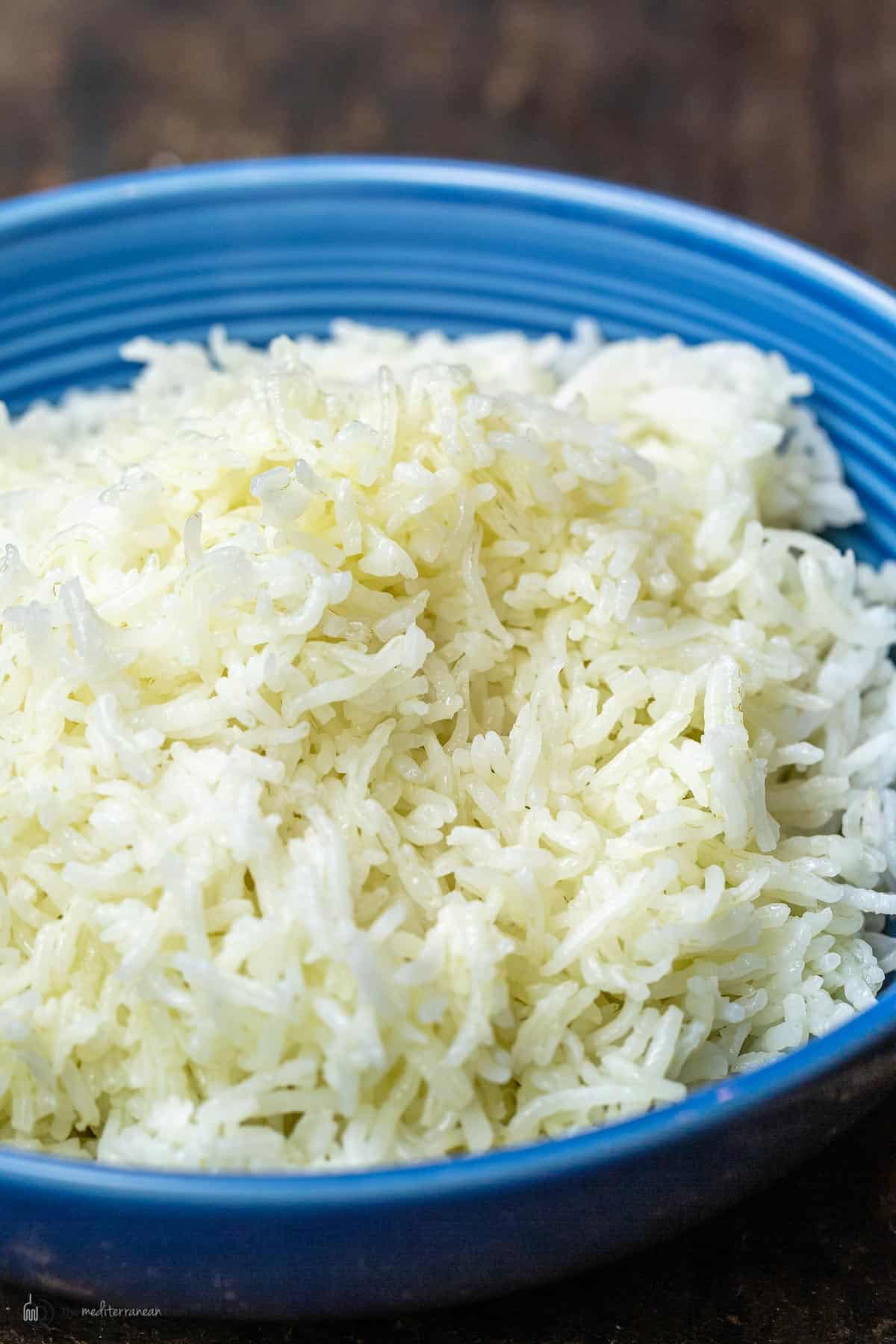 A blue dish with a heap of basmati rice