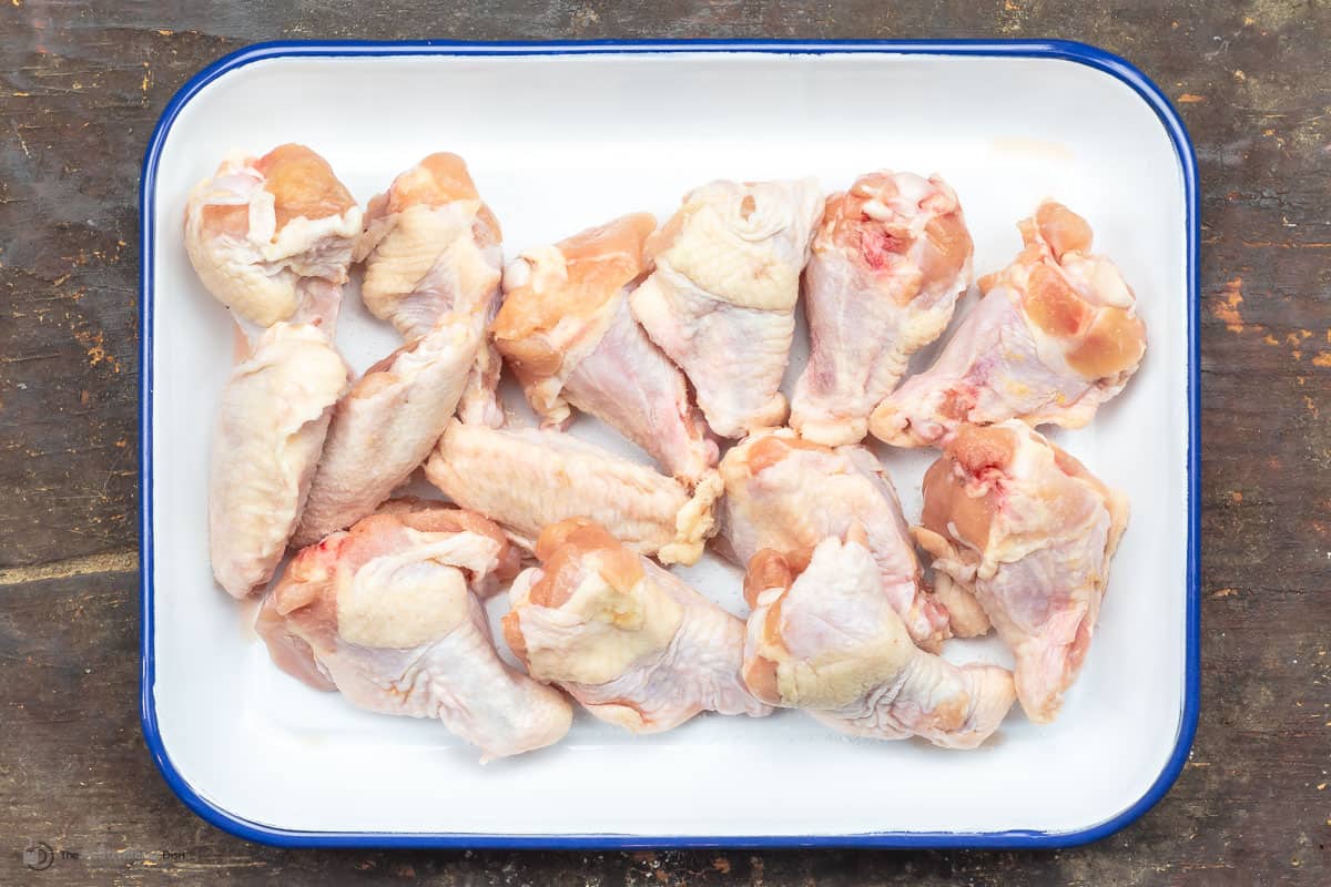 A tray of raw chicken wings